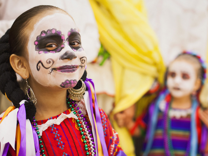 Hispanic children celebrating Dia de los Muertos